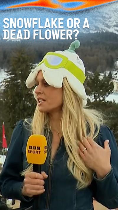 BBC Sport presenter Chemmy Alcott wears a white hat in the shape of a snowflakewith googles