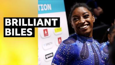 Simone Biles celebrates winning the all-around gold medal at the Gymnastics World Championships