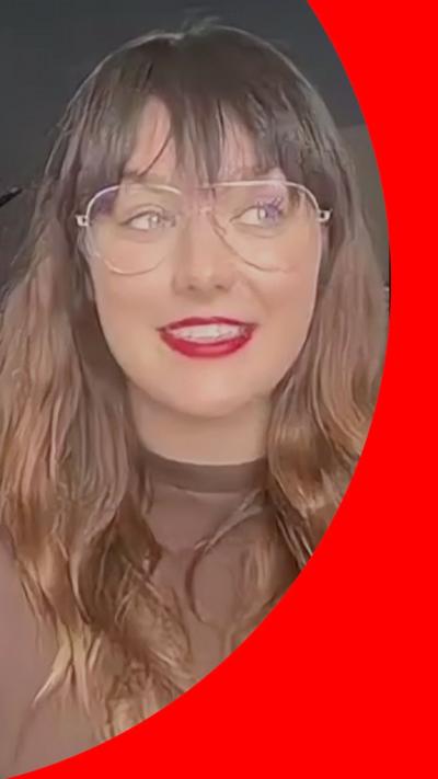 Ewa Farna has long brown hair, aviator glasses and bright red lipstick 