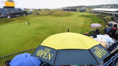 Umbrellas up in readiness for the Golf Open
