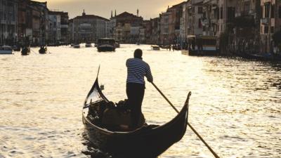 Canal Grande at sunset in Venice with gondola