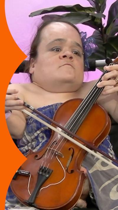 Gaelynn Lea plays a violin in the a BBC radio studio