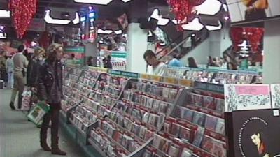 People browsing a record store