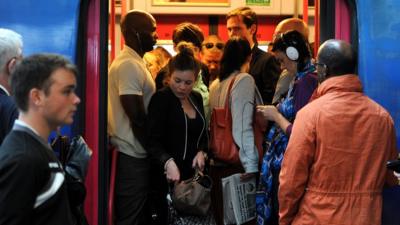 Commuters making their way off a train at Blackfriars Station, London.