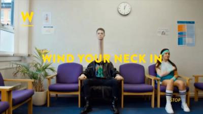 A person with an elongated neck with the words "WIND YOUR NECK IN"