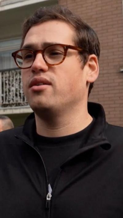 Taub speaking to the camera near the site of the arson