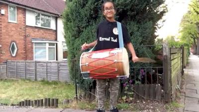 Kirpa supports the NHS outside her home in West Bromwich