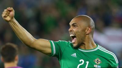 Former goalkeeper Josh Magennis showed his goal-scoring instincts as Northern Ireland booked their place at Euro 2016