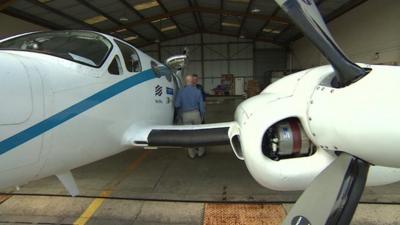 Joss Kent and Peter Gibbs next to Met Office plane