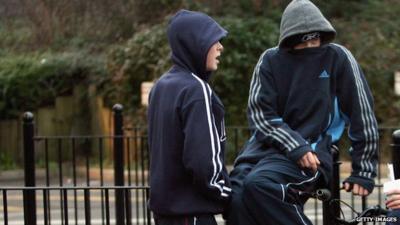 Flie photo from 2007 of young people in hoodies on a Bristol housing estate