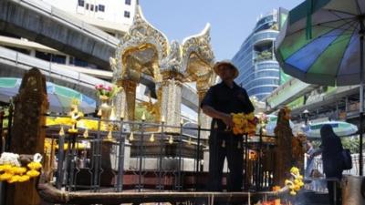 Man at reopened shrine in Bangkok