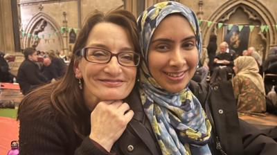 Two women smiling at the camera