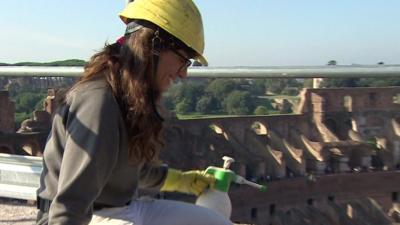 Woman working on roof