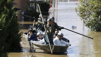 Local residents are rescued by Japapnese Defence-Force soldiers from a flooded area caused by Typhoon Hagibis in Kakuda