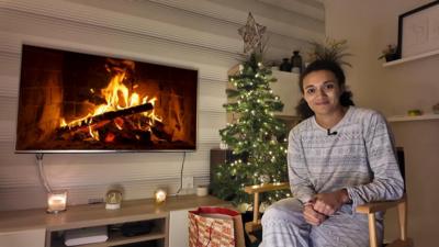 Nina sat down watching TV