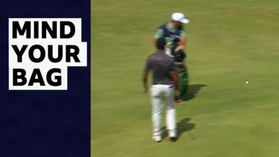 Aaron Rai and caddie