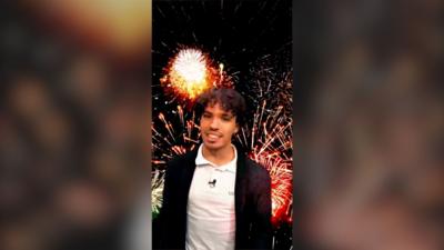 Presenter Tyler Edwards superimposed on top of fireworks