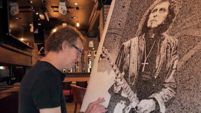 Kirk Andrews working on his Tony Iommi piece