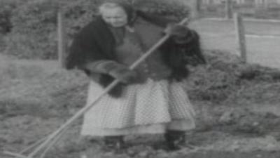 1965 image of Woman gardening at Penrhos Polish Home, Pwllheli, Gwynedd