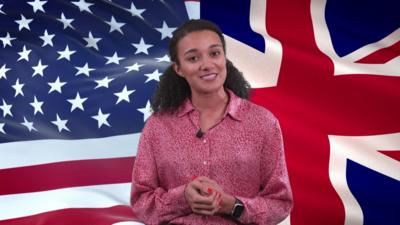 Nina in front of the flags of the US and UK.