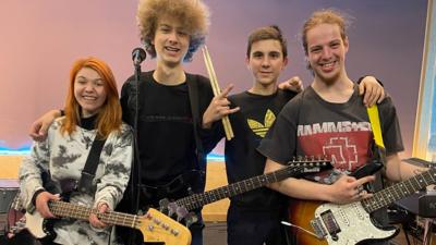 Band members posing with their instruments