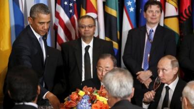 Russian President Vladimir Putin looks up at U.S. President Barack Obama after Obama delivered a toast during the luncheon at the United Nations General Assembly in New York