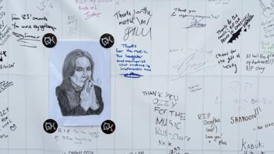 Ozzy tributes written on a banner on display at Bloodstock Festival, with a hand sketched portrait of Ozzy in the center.