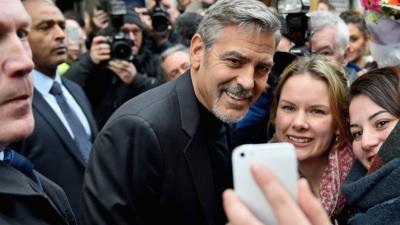 George Clooney meeting fans outside the Social Bite cafe in Edinburgh