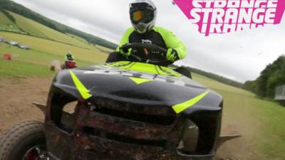 A man riding a lawnmower