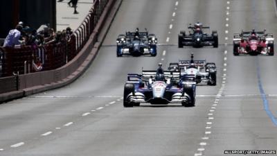 IndyCar driver Marco Andretti, driving Justin Wilson's No 25 car, leads a motorcade in honour of Wilson over the Golden Gate Bridge