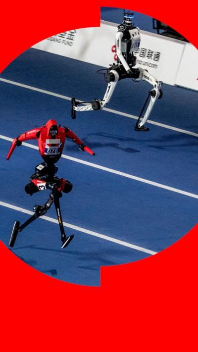 Two humanoid robots sprinting along an athletics track.
