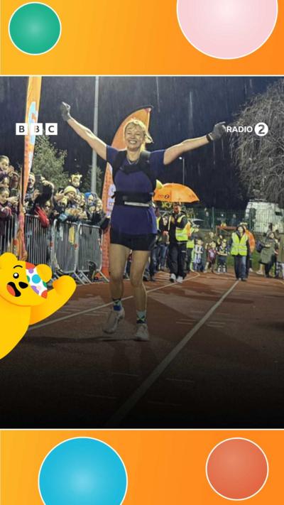 Sara Cox crosses the finish line