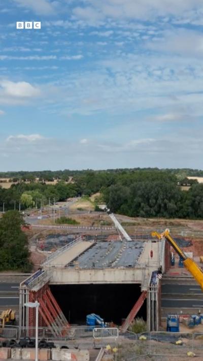 Construction work on a bridge over a dual carriageway