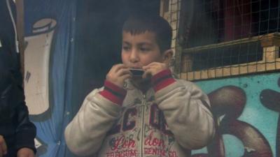 Boy playing harmonica