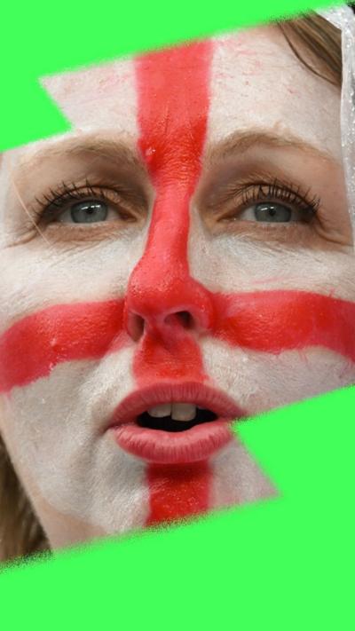 Close up of England football fan with St George's flag painted on her face looks into the middle distance