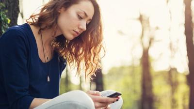 girl looking at phone