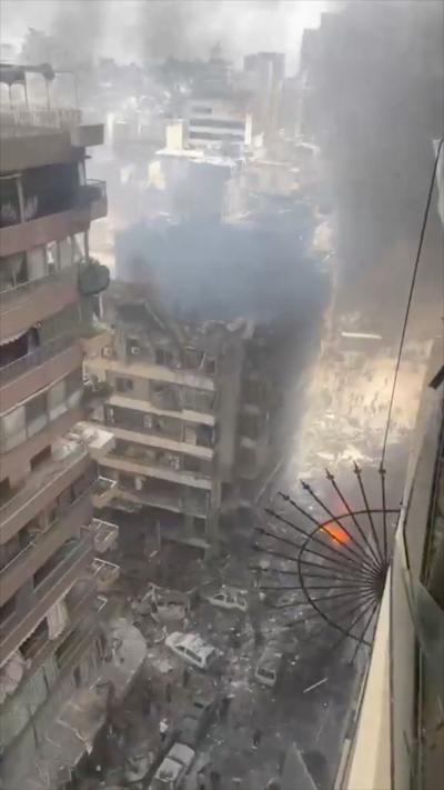 Damaged tower block after an Israeli strike in Beirut