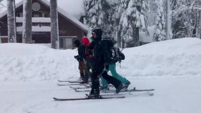 People walk on skis in California