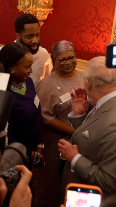 The King meets Bemi Orojuogun at a reception in St James's Palace
