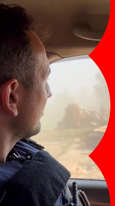 Hugo Bachega looks out of a car window