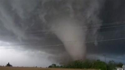 Tornado behind power lines in Enid, Oklahoma