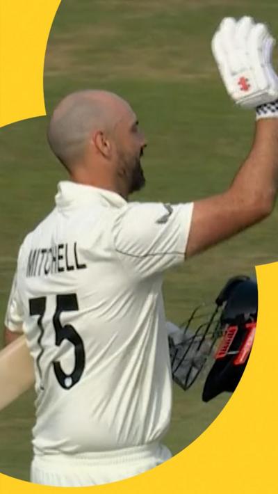 Daryl Mitchell waves to the crowd after hitting a century on day four of England v New Zealand.