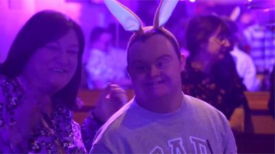 Club-goer enjoying nightclub experience