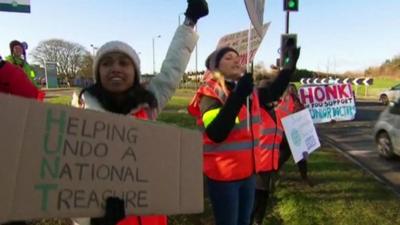 Junior doctors holding placards