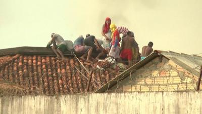 Smoke billows from the prison after the riot