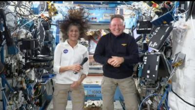 Suni Williams and Barry 'Butch' Wilmore grin as they float aboard the International Space Station