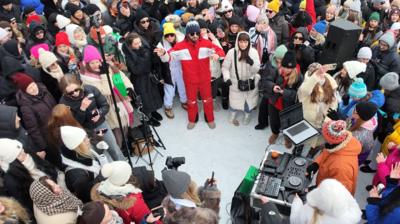 People in a circle with a DJ booth