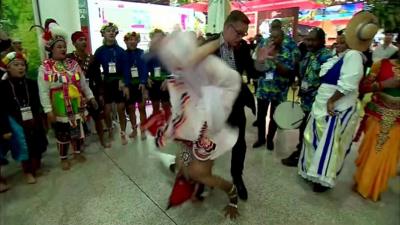 A dancer flips into the BBC's Aaron Heslehurst