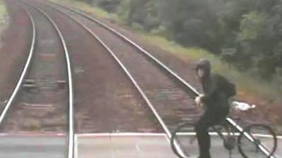 Cyclist on level crossing