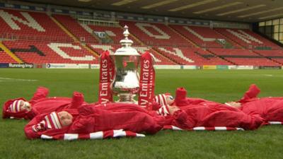 Babies next to FA Cup